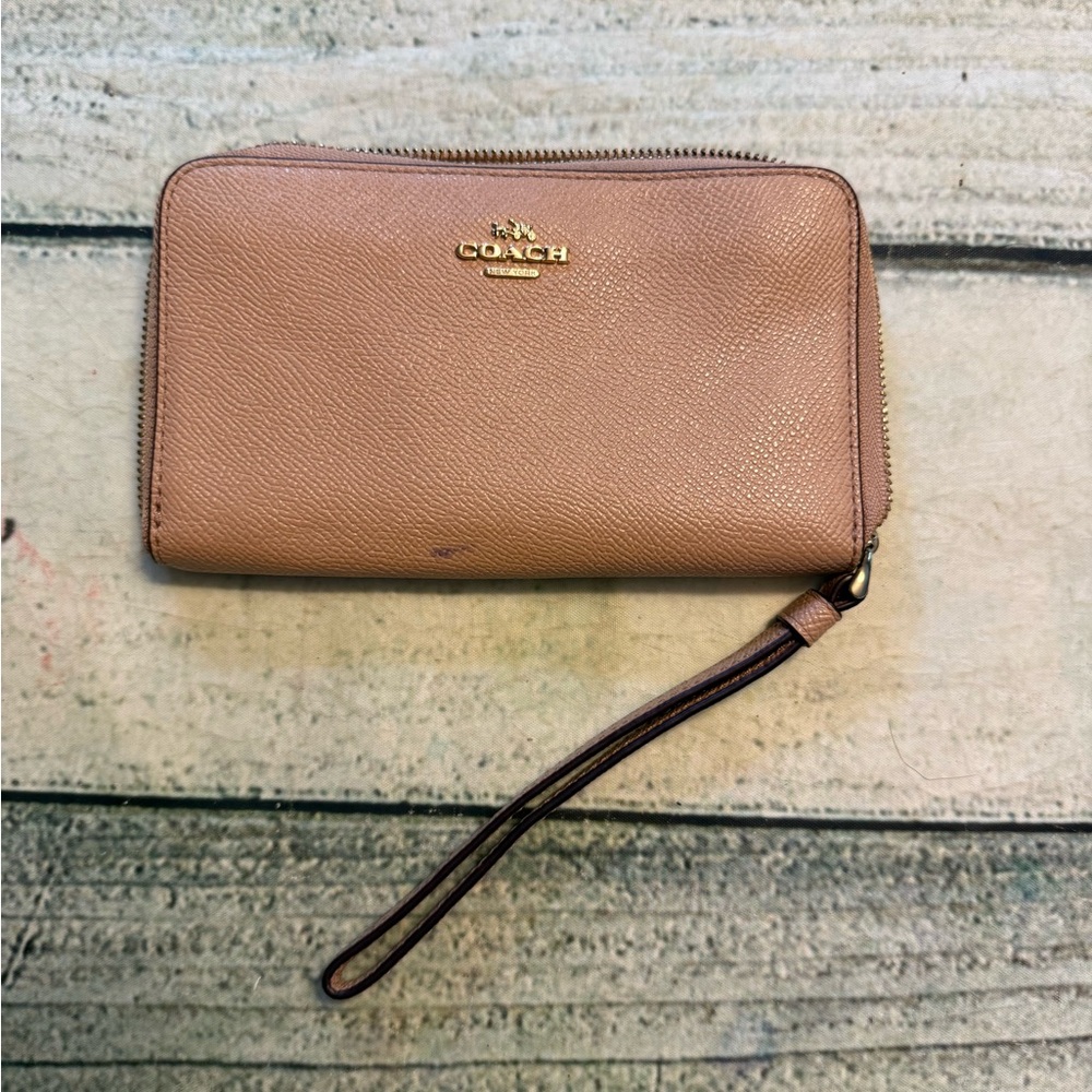 Coach factory tan/ cream color zip around wallet.